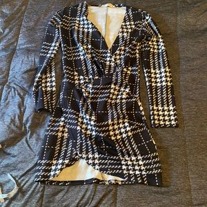 3/$20 Black white stretchy wrap looking plaid dress. See description